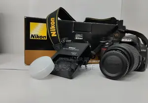 Nikon D3100 + 18 55mm