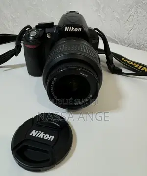 Nikon D3100 + 18 55mm