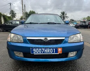 Photo - Mazda 323 1999 Bleu