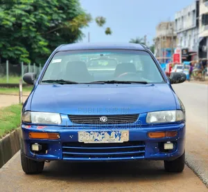 Photo - Mazda 323 2.0 2001 Bleu