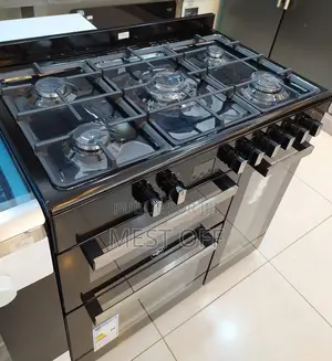 Photo - Cuisinière À 5 Feux, 2 Fours Et 1 Casier Pour Bouteille De Gaz