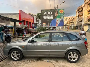 Mazda 323 1.6 2003 Gris