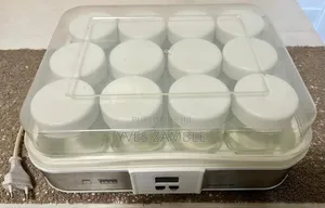Photo - Machine Pour Faire Les Yaourts Avec 12 Pots De Yaourts À L Intérieur.