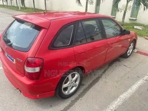 Mazda 323 1.6 2002 Rouge