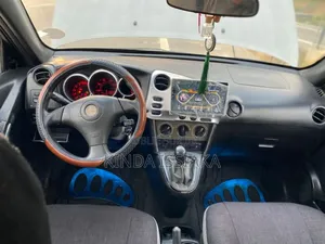 Toyota Matrix Standard AWD (1.8L 4cyl 4A) 2003 Gris