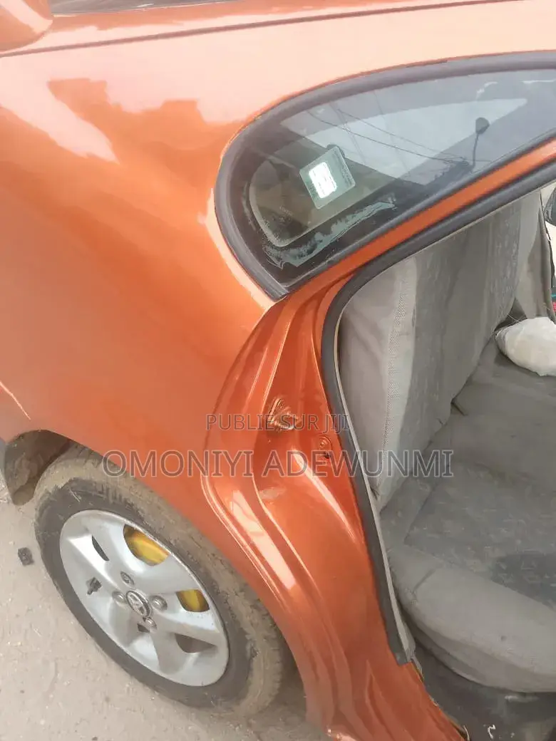 Toyota Corolla Hatchback 1999 Orange