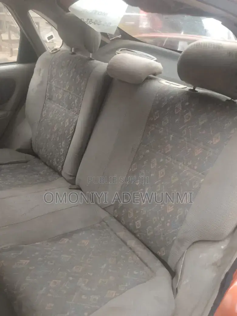 Toyota Corolla Hatchback 1999 Orange
