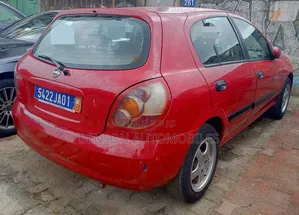 Nissan Almera Tino 2002 Rouge