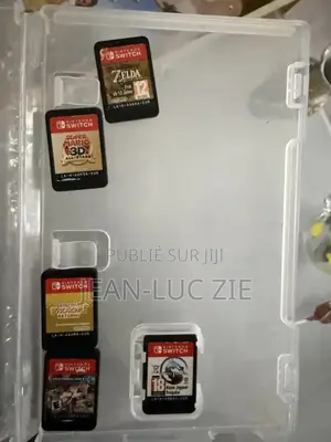 Nintendo Switch + 5 Jeux + Accessoires — À Vendre