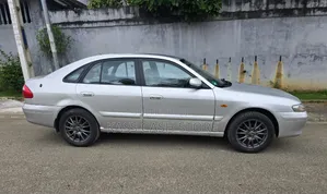 Mazda 616 2002 Gris